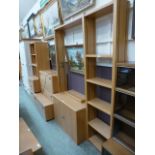 A large quantity of modern oak cabinets to include bookcases, drawers,