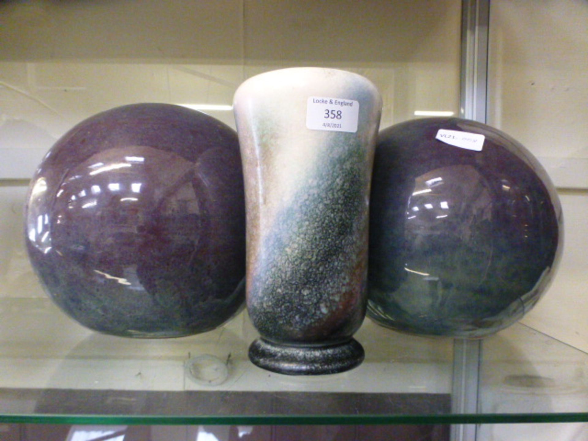 Two stoneware spears together with a similar matching vase