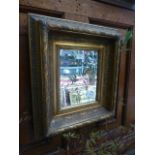 An ornate gilt framed beveled glass rectangular mirror