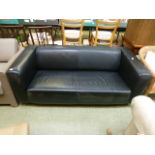 A black leather Chesterfield settee