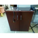 A cherry wood effect wine cabinet