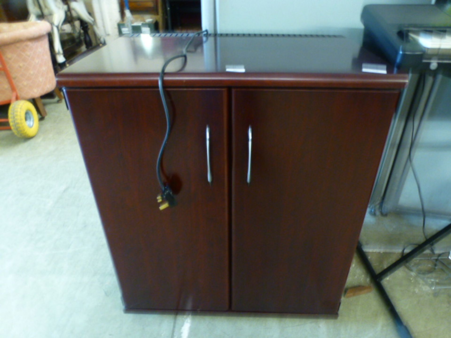 A cherry wood effect wine cabinet