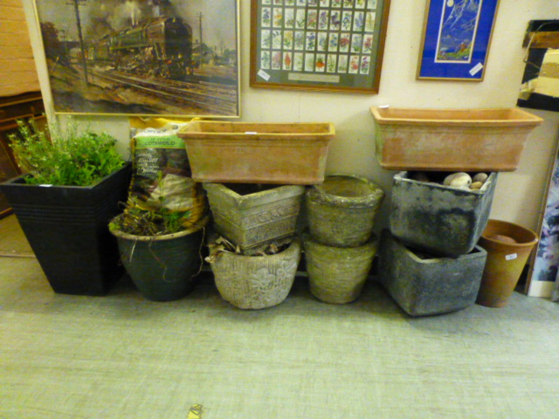 A selection of garden pots, to include terracotta,