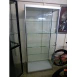 A metal framed display cabinet with five adjustable shelves and two side doors, h.