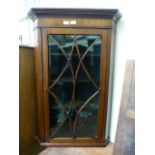 A Georgian style mahogany corner wall mounted cabinet with glazed door