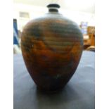 An iridescent pottery vase of ovoid form,