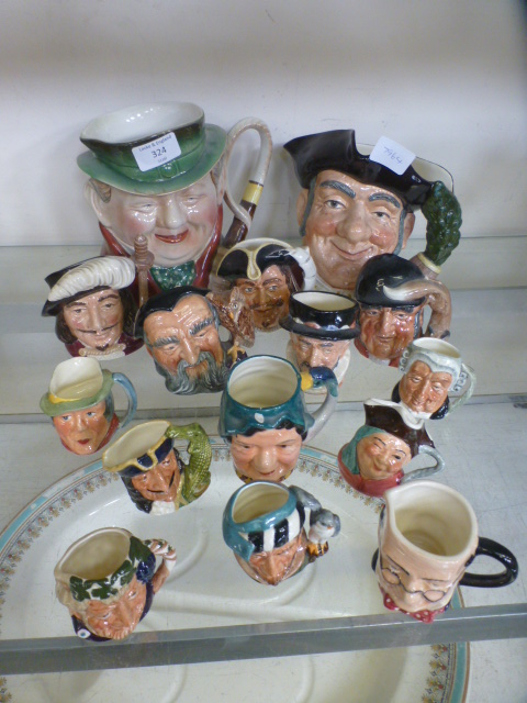 An assortment of Royal Doulton and other character jugs to include 'The Falconer', 'Merlin',