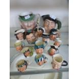 An assortment of Royal Doulton and other character jugs to include 'The Falconer', 'Merlin',