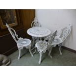 A white painted aluminium garden table with four matching chairs