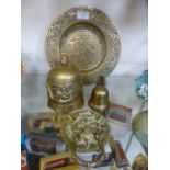 A selection of eastern brass items to include plates and a foo dog door knocker