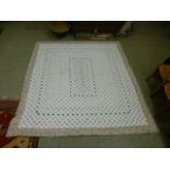 A quilted floral decorated bed cover,