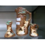A Hornsea Fauna jug modelled as a tree trunk with deer and a squirrel together with two smaller