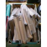 A box containing a large quantity of Matilda the Musical wooden rulers