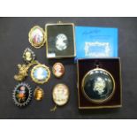A 9ct gold cameo together with an assortment other brooches etc.