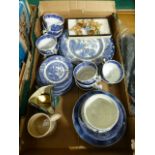 A tray containing blue and white ceramic ware, Wade whimsies etc.