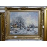 An ornate gilt framed oil on canvas of a winter village scene signed bottom right