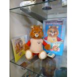 A Teddy Ruxpin together with box and booklets etc.