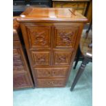 A Chinese hardwood bank of six drawers with bird design