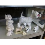 A collection of moulded figures of dogs