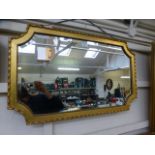 A gilt framed bevel glass wall mirror