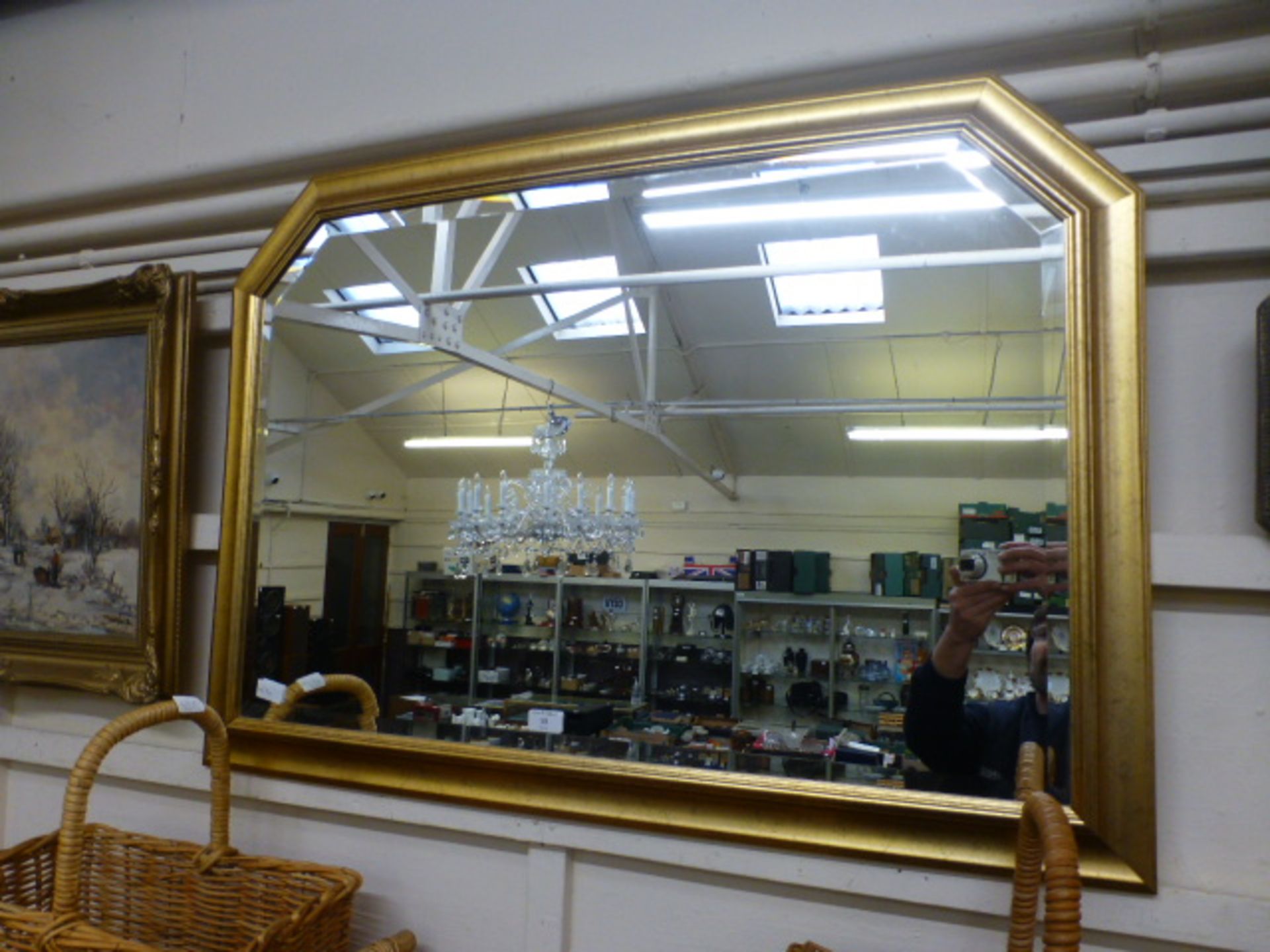 A modern gilt framed bevel glass wall mirror