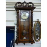 A late Victorian walnut Vienna wall clock