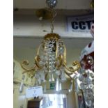 A gilt metal and cut glass droplet ceiling light