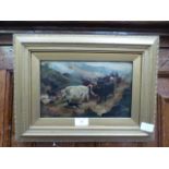 A gilt framed oil on board of farmers with cattle