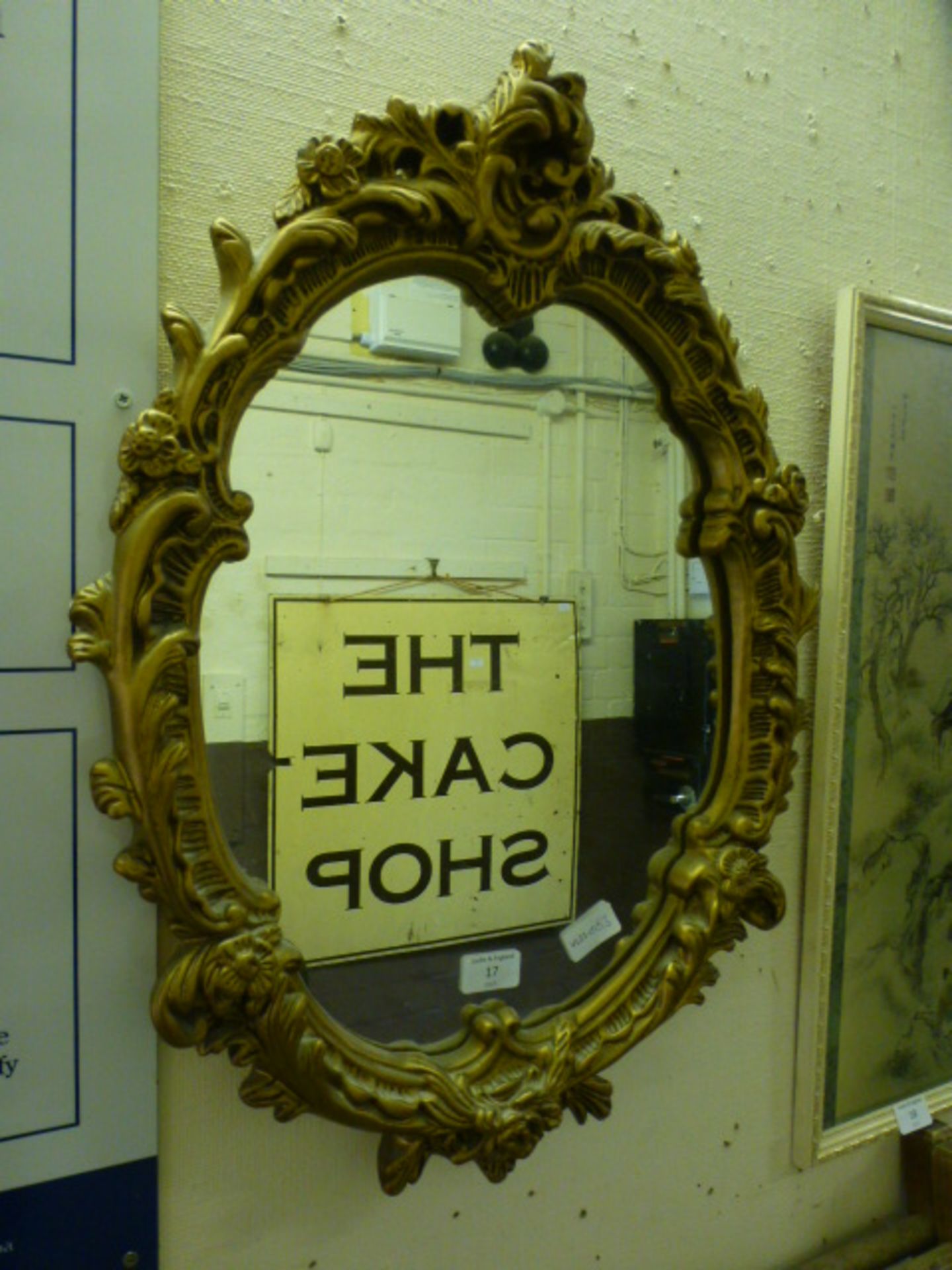An ornate gilt framed wall mirror