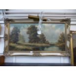 A gilt framed oil on canvas of a country lake scene