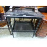 A black painted two tier table