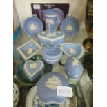 A collection of blue and white Wedgwood jasper ware to include pin dishes, pots etc.