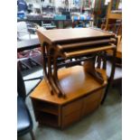 A nest of three mid-20th century teak occasional tables together with a corner two door cabinet by