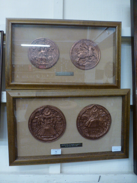 A pair of framed and glazed reproduction second seal of Queen Elizabeth I and the third seal of