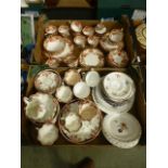 Two trays of decorative ceramic ware to include cups, saucers, plates etc.