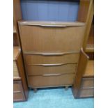 A mid-20th century teak bureau having three drawers below fall