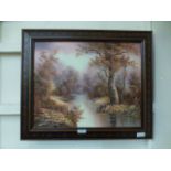 A modern framed oil on canvas of a river running through wooded scene signed L.