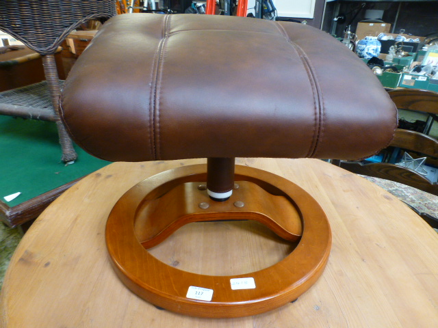 A modern brown upholstered stool