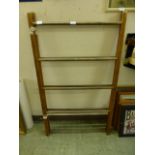 An early 20th century pine folding clothes rail