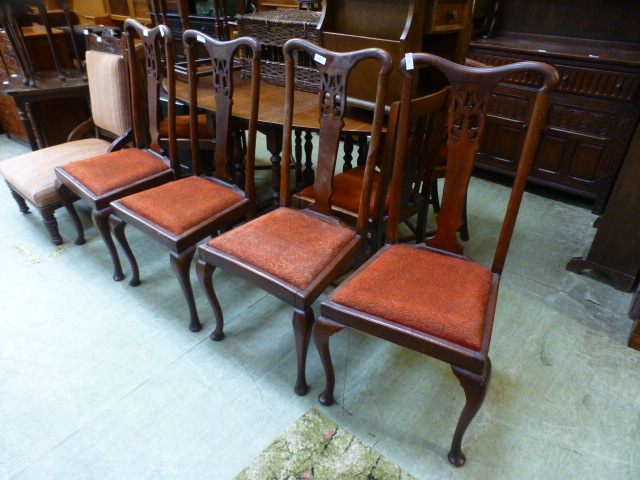 A set of four Queen Anne style dining chairs with drop-in seats