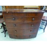 An 19th century flame mahogany bow fronted chest of two short over three long drawers