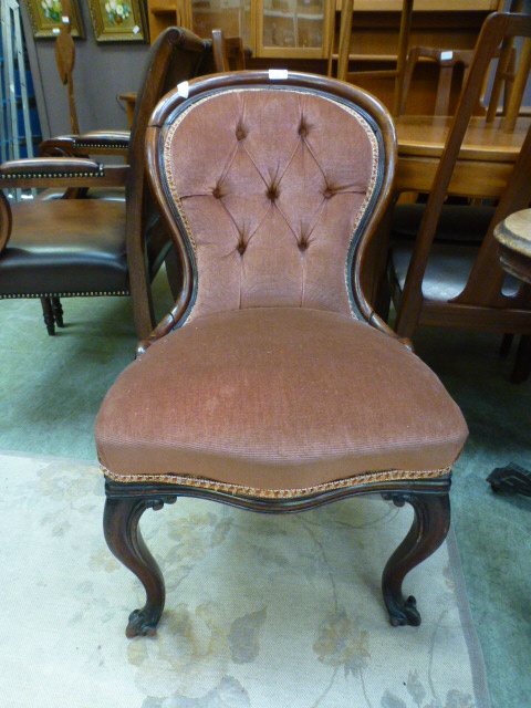 A Victorian mahogany spoon back chair upholstered in a brown Draylon button back fabric (A/F)