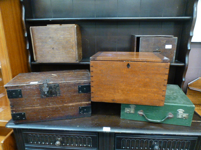 A selection of four wooden boxes together with a green canvas case