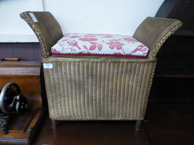 A gold painted Lloyd Loom stool with lift-up seat