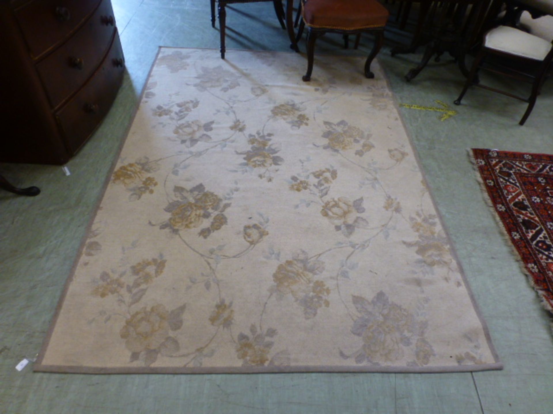 A modern Laura Ashley rectangular rug with rose design