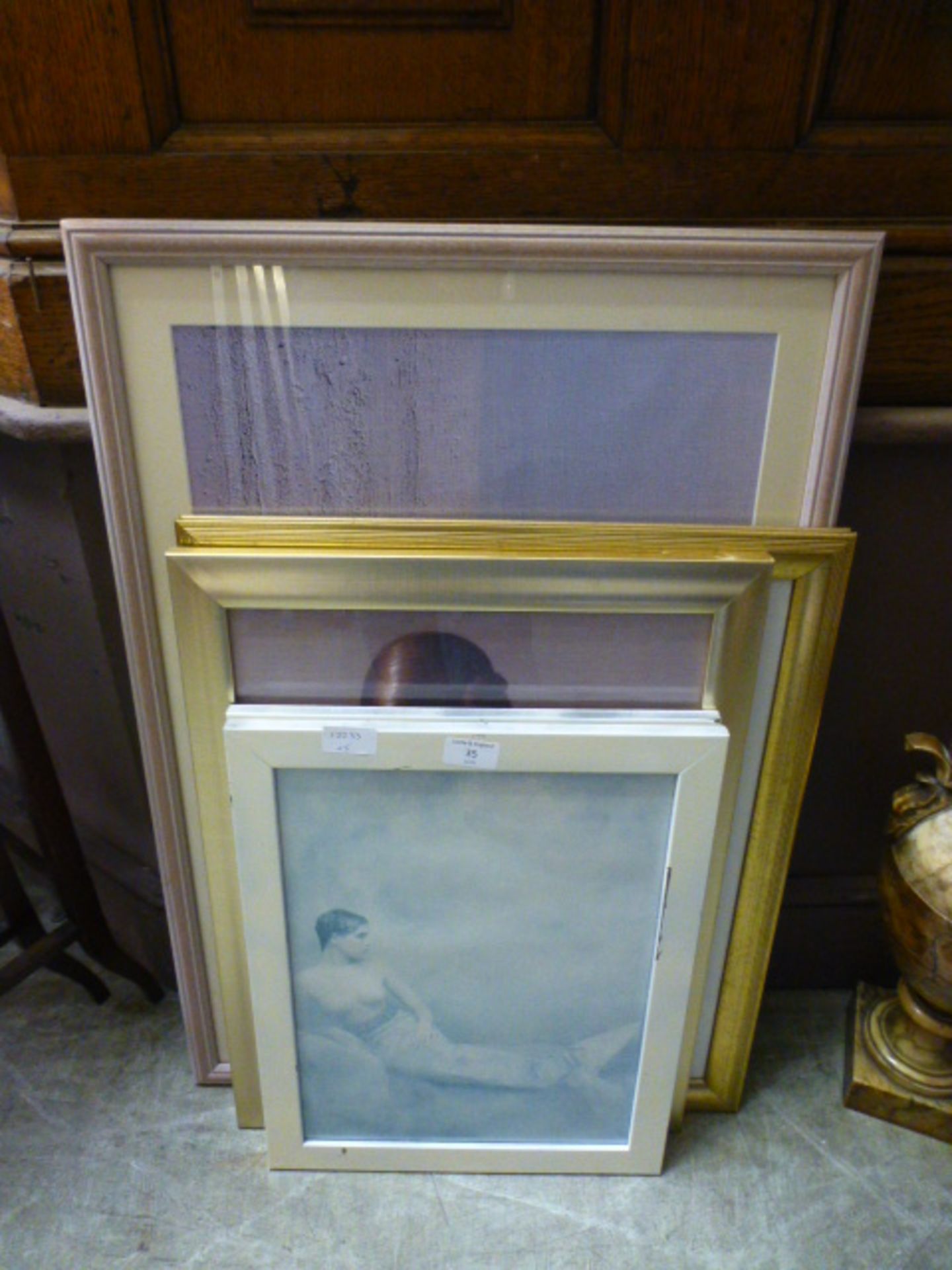 A selection of four framed and glazed prints of young ladies to include early Pirrelli calendars