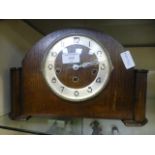 A mid 20th century oak cased mantle clock