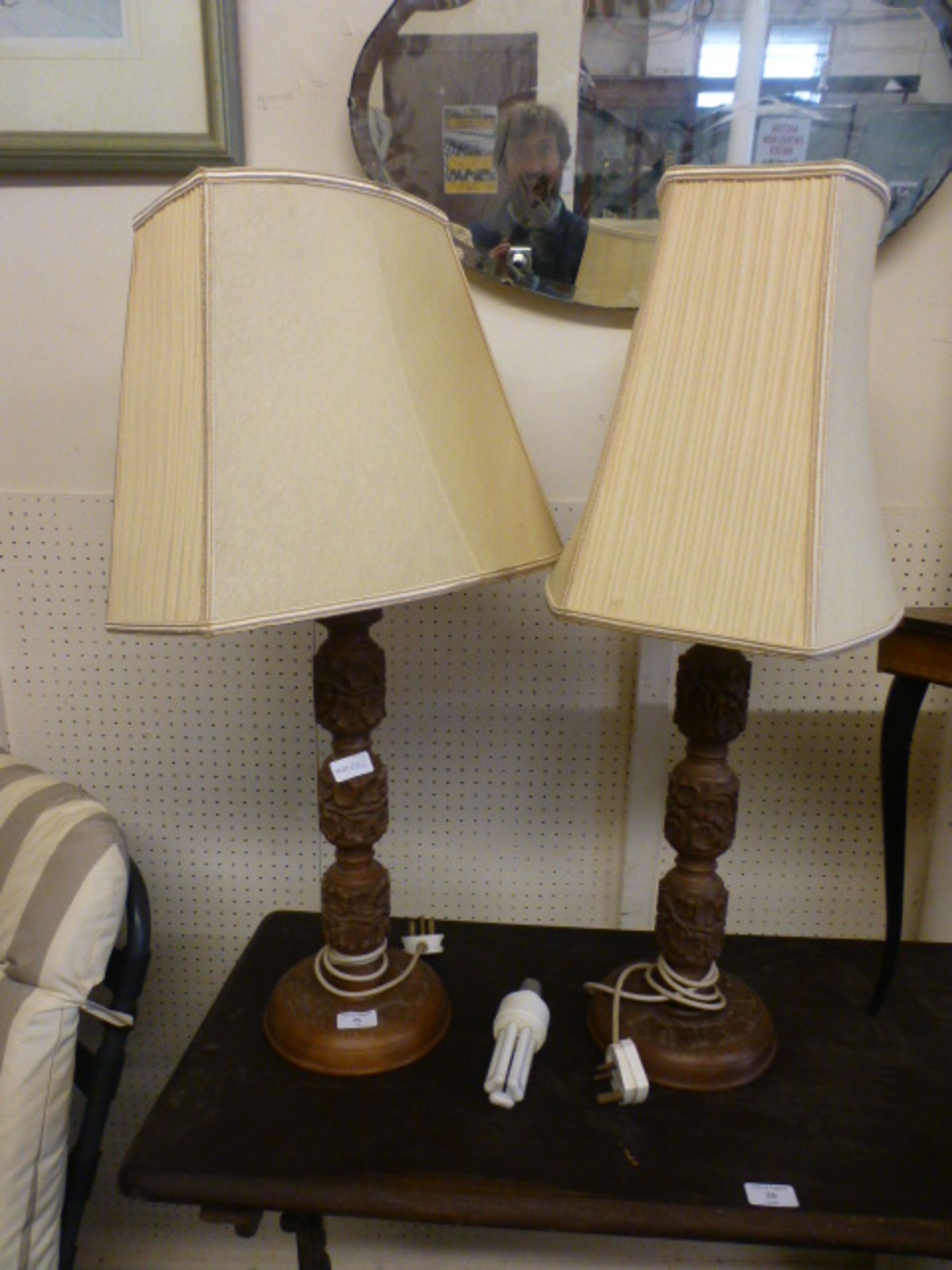 A pair of Indian floral carved table lamps