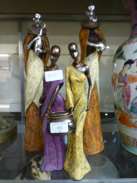 A collection of four African moulded figures