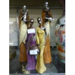 A collection of four African moulded figures